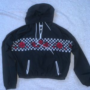 black jacket with checker board and red roses on front. in great condition.